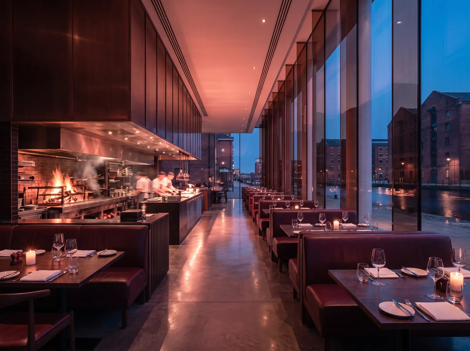 Ember & Salt: an open wood-fired hearth beside oxblood leather banquettes and candlelit tables